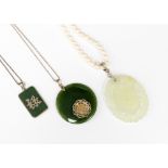 Two Chinese jade pendants with silver chain and Chinese symbols;