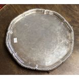 A George VI silver salver, the gadrooned and fluted ogee border with vacant interior,