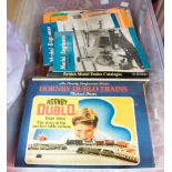A box containing books and magazines relating to model railway: three books from the Hornby