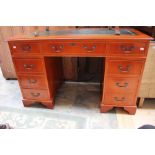 A mahogany twin pedestal desk, inset with leather top,