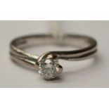 A diamond solitaire 18ct white gold ring, the round brilliant cut diamond approx 0.