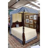 A George III style mahogany four poster double bed, 19th Century and later,