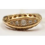 An 18ct gold boat ring set with five (tested) diamonds. Ring total gross weight 3gms, size K.