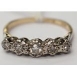 A five stone 18ct gold and platinum diamond ring, size N½ with a total gros weight of 2.