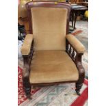 A pair of Victorian upholstered armchairs, with padded backs, turned arm supports, upholstered seat,