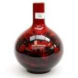 A Royal Doulton Flambe Ware Woodcut bottle vase,