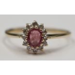 A pink sapphire and diamond cluster ring set in 9ct gold size O, with a total gross weight approx 1.