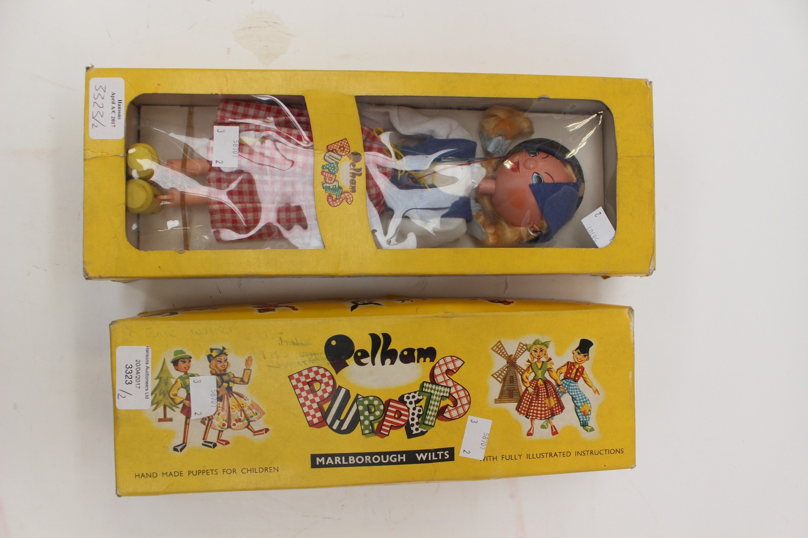 Two boxed Pelham puppets,