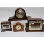 A 1930s oak mantel clock; Napoleon clock; Burr walnut,