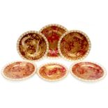Royal Crown Derby, a collection of Old Avesbury plates with deep red ground with gilded birds,