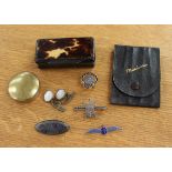 A papier mache snuff box with tortoiseshell decoration, two silver brooches, pair of cufflinks,