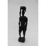 A hand carved African Tribal Warrior figure