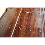 A George III mahogany chest on chest, the upper section with a plain dentil moulded cornice,