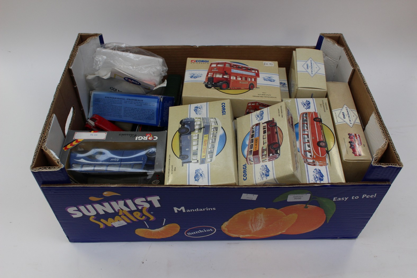 Approximately eighteen boxed Corgi Classics buses,