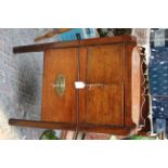 A George III mahogany washstand, fitted with two doors over a single drawer,