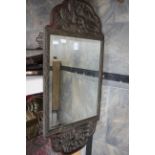 A circa 1920s Chinese wall mirror with carved frame