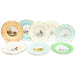 A group of eight Royal Crown Derby cabinet plates, seven of which are signed W.E.J.