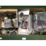 Angling interest: A box of fishing reels, some in boxes,