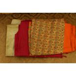 A gold woven , embossed, length of Indian silk, a Burgundy checked piece of pure silk,