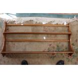 An Ercol elm wall rack