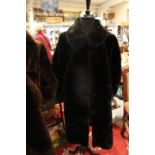 A faux fur coat,