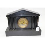 A large slate mantle clock in the Classical Columnar style