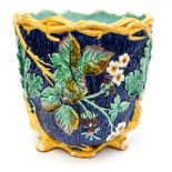 A large Wedgwood jardiniere molded as an oak tree base and raspberry bramble top decoration,