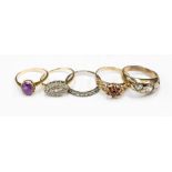 Five silver, gilt and yellow metal rings, garnets,