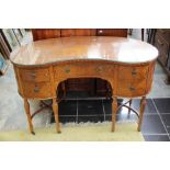 A pair of Edwardian Sheraton style Satinwood kidney shaped dressing tables,