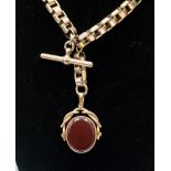 A Victorian gold watch chain with gold agate set swivel, gross weight approximately 69.