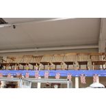 A matched set of nine beech framed Windsor style chairs, solid seats,