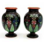 A pair of circa mid 19th century vases with foliate design,
