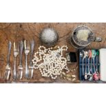 An assorted lot to include three simulated pearl necklaces,