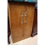 An Art Deco oak tallboy,