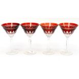 A set of four Waterford Clarendon ruby Martini glasses, faceted stems, star cut bases,