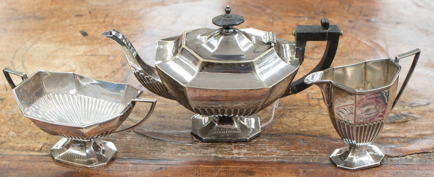 An Edwardian Walker & Hall silver plated three piece tea service