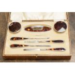 A silver and Tortoiseshell dressing set,