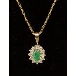 A 9ct gold diamond and emerald pendant necklace, 1.