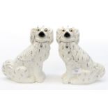 A pair of 19th Century Staffordshire Dogs, white glazed with gilt highlights,