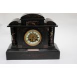 An Edwardian slate and marble clock,