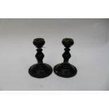 Pair of ebonised Victorian candlesticks with silver bands