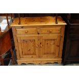 A contemporary pine side cabinet,