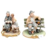 Two Capo di Monte figures, of a tramp on bench and grandmother reading to children, both signed,