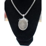 A Victorian silver oval locket and chain