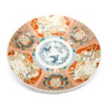 A large Imari charger with underglaze, blue and white centre,