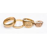 A 9ct rose gold signet, size E1/2, a 9ct gold engraved signet size Q,