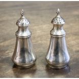 A pair of Edwardian silver pepperettes, London 1904, maker Charles and George Asprey 53.4 grams/1.
