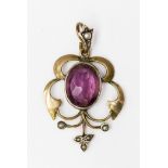 An amethyst and seed pearl yellow metal pendant,