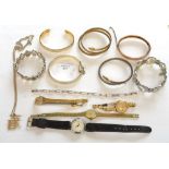 A collection of bangles and watches including yellow metal
