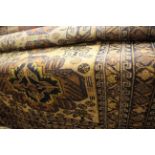 A Persian rug, dark blue ground with deep cream, beige, green pattern,